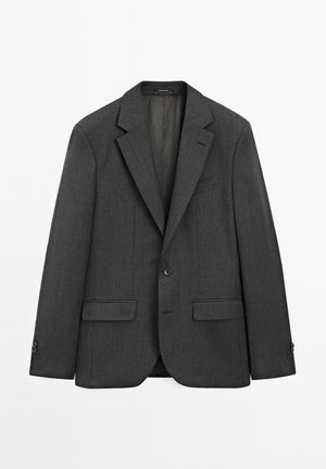 Donkergrijze blazer van gestructureerde stof. Heeft een revers met inkeping, een sluiting met één knoop en twee steekzakken aan de voorkant. Klassiek getailleerd ontwerp.