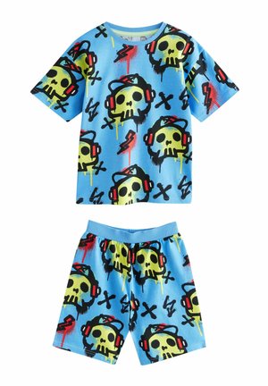 Blue cotton pajama set featuring short-sleeved shirt and shorts, decorated with large yellow skull graphics, headphones, and lightning bolts.