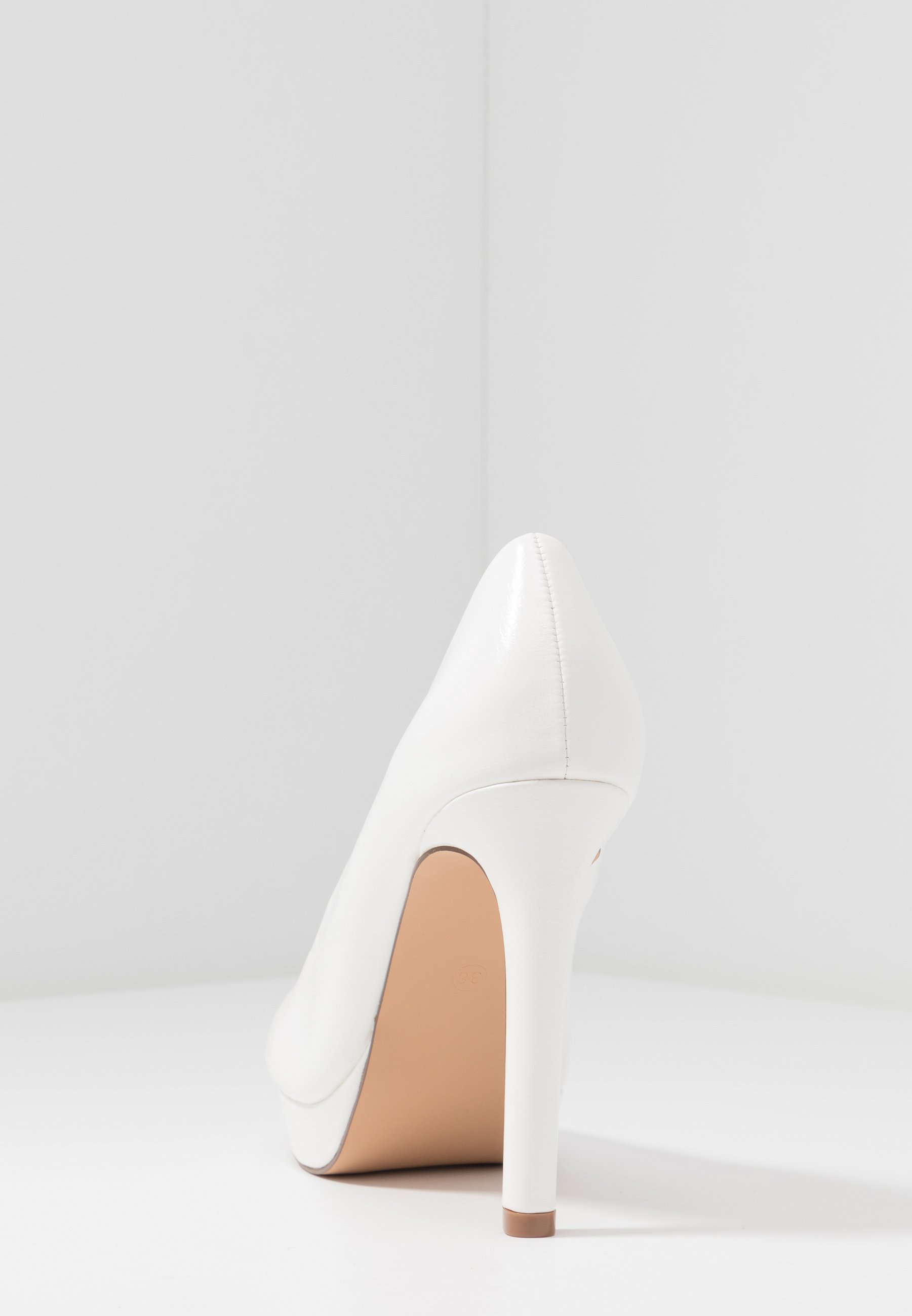 wide white pumps