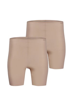 Two pairs of beige seamless mid-thigh length shorts with a fitted design and small "Skiny" logo near the waist.