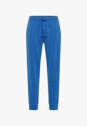 Pantalones de chándal azules hechos de un tejido suave. Presentan una cinturilla elástica con cordón y tobillos ajustados. Detalle del logo en el lateral.