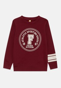 Felpa bordeaux con un logo stampato rotondo bianco, che presenta il testo "ATHLETIC SPORTING GOODS" e l'anno "1967". Strisce bianche sulle maniche.