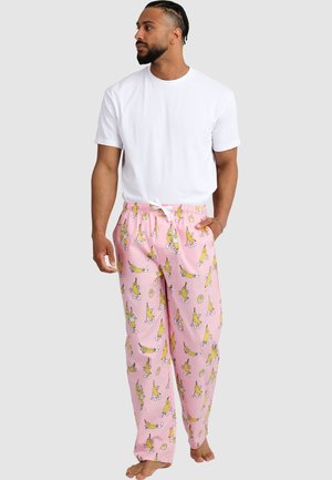 Light pink pajama pants featuring a banana and roller skate pattern; elastic waistband with drawstring; soft fabric, relaxed fit.