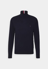 Maglione a collo alto blu navy realizzato in tessuto a maglia liscia. Presenta un colletto a coste con strisce rosse, bianche e blu e un piccolo logo sul petto.