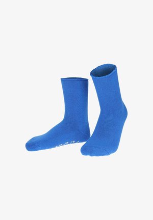 Blue cotton socks with ribbed texture, crew length, and white circular grip dots on the soles for traction.