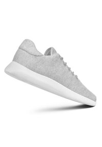 Light gray sneakers with a knitted upper, rounded toe, and smooth white rubber sole. Features subtle lacing and a cushioned collar.