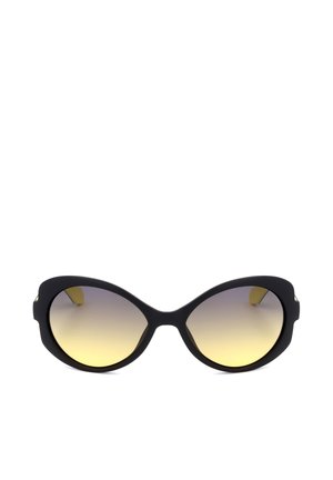 Occhiali da sole neri oversize con montatura arrotondata e lenti sfumate gialle, mostrati su sfondo bianco semplice.