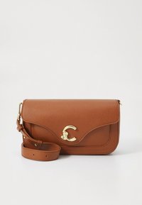 Brown pebbled leather crossbody bag with a curved flap, gold hardware, and adjustable strap; features embossed logo and smooth texture.