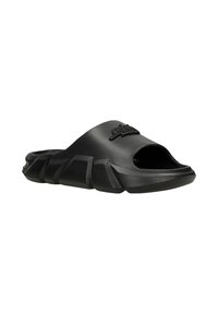 Black rubber slide sandal with an open toe, featuring a thick textured sole and raised logo accent on the upper strap. Rounded, chunky design.