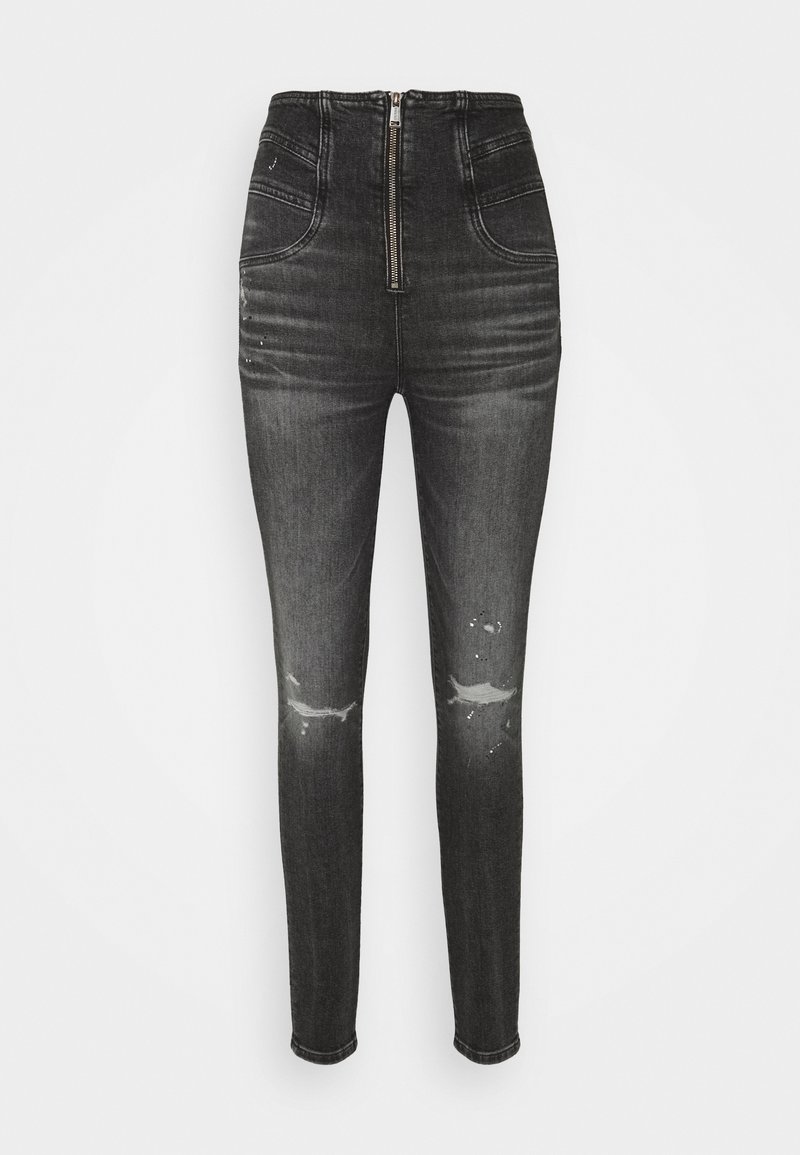 Jeans de mezclilla negros de cintura alta con cierre de cremallera, detalles desgastados en las rodillas y un ajuste ceñido. Cuenta con dos bolsillos frontales y una textura suave.
