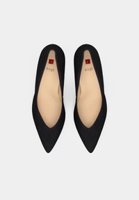 Black suede pointed-toe pumps with a low cut design. Interior features a beige insole with logo; soles are textured for grip.