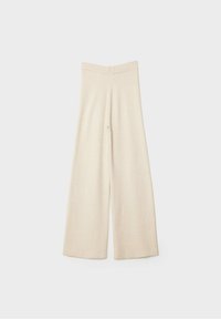 Pantalon large couleur crème avec taille haute et ourlet droit, présenté sur un fond gris clair uni.