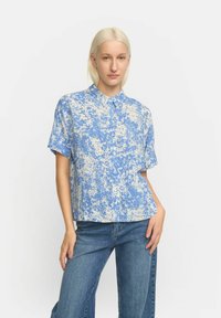 Short-sleeve, collared shirt in blue with cream abstract splatter pattern. Made from a lightweight fabric, cut in a relaxed fit.