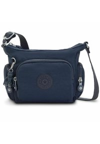 Navy blue crossbody bag made of durable nylon. Features a logo patch, multiple zippered pockets, and a adjustable strap. Smooth texture.