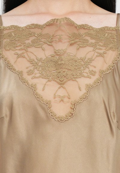 Satin brown top with a scalloped sheer lace neckline featuring intricate floral embroidery in gold. Smooth texture with adjustable straps.