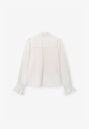 Chemisier blanc à manches longues avec col à boutons, détail froncé au dos et poignets volantés. Tissu lisse au design uni.