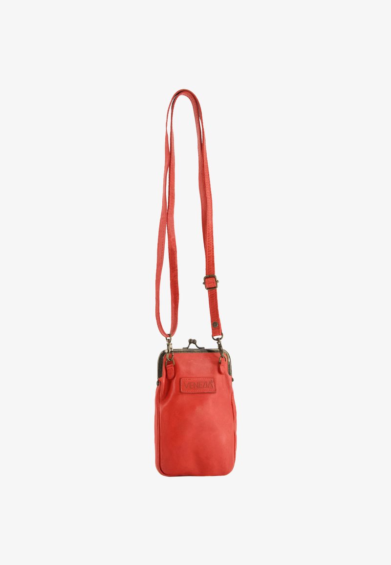 Red leather crossbody bag with a smooth texture, adjustable strap, and a metallic clasp. Features a branded tag and a compact design.
