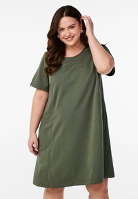 Olive green dress made of soft cotton blend, featuring short sleeves, a round neckline, two front pockets, and a relaxed fit.