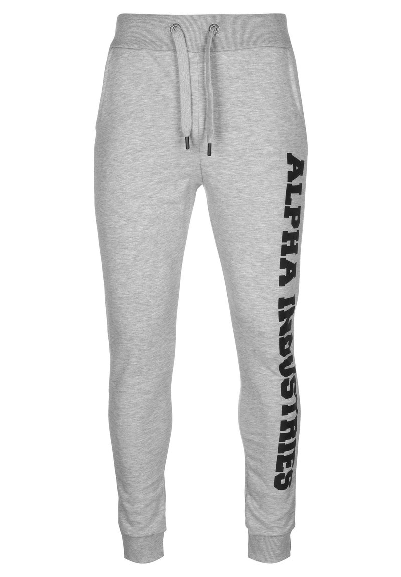 Graue Jogginghose mit schmal zulaufendem Bein, elastischem Bund und Kordelzug. Auf der linken Seite befindet sich ein schwarzes vertikales Logo.