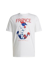 Vit bomullströja med en grafisk design av en tupp och ankare i blått, rött och vitt, med texten "FRANKRIKE" och "HANDBOLL".
