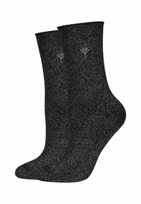 Calzini neri con una texture metallica e un elegante design floreale ricamato sul risvolto. Tessuto morbido, lunghezza a metà polpaccio.