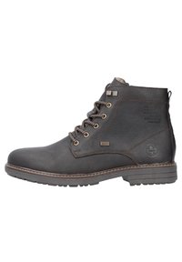 Botas de tobillo de cuero marrón con cordones, ojales de metal, superficie texturizada y suela de goma. Presenta detalles de logo y marca en el lateral.