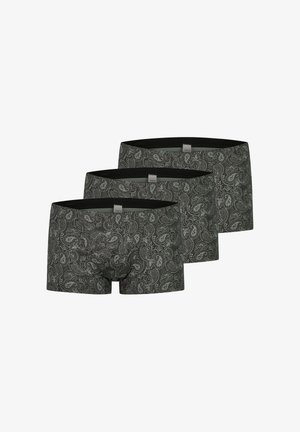 Tre par sorte boksertrusser med hvid paisley-mønster arrangeret i en forskudt række mod en hvid baggrund.