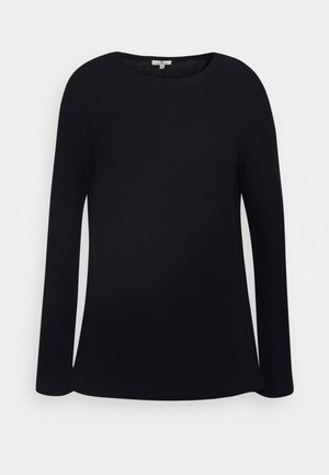 Pull noir à manches longues avec col rond, tissu légèrement texturé et ourlet droit, présenté sur un fond blanc uni.