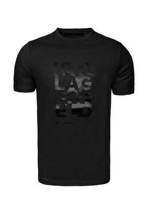 Zwart T-shirt met korte mouwen en ronde hals, met glanzende, reliëf "KARL LAGERFELD" tekst verticaal gecentreerd aan de voorkant.