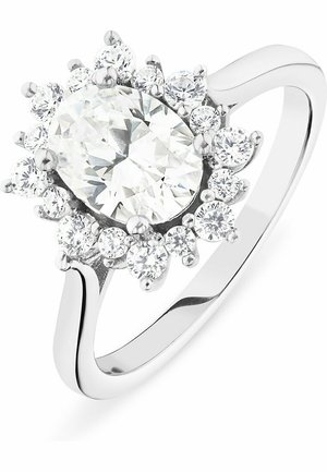 Weißgoldring mit einem ovalen, klaren Mittelpunkt, umgeben von kleineren runden Steinen in einer blumigen Anordnung. Glatte Band mit polierter Oberfläche.