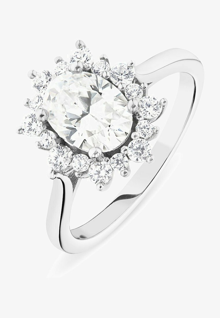 White gold ring featuring an oval clear center stone surrounded by smaller round stones in a floral arrangement. Smooth band with polished finish.