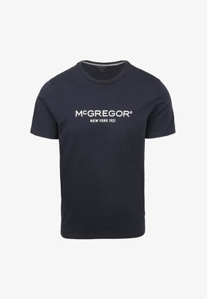 Marineblauwe katoenen t-shirt met korte mouwen en ronde hals. Heeft een witte logo "McGREGOR NEW YORK 1921" gedrukt over de borst.