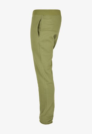 Pantaloni de trening verzi dintr-un material moale, cu un tiv elastic, buzunare laterale și un design conic pentru o siluetă ajustată.