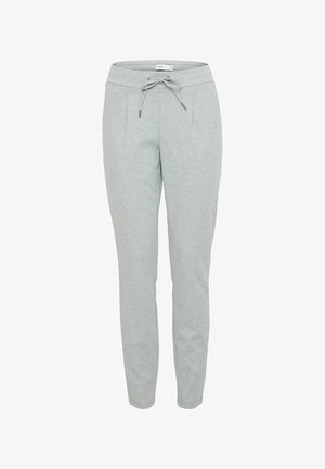 Heledad hallhalli pehmete kangastega, millel on valmistatud paelaga vöökoht, kitsenevad jalad ja küljetaskud koos tagasihoidlike õmblusdetailidega.