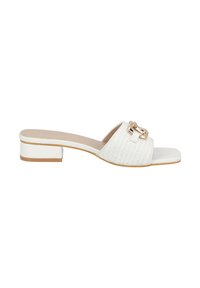 White heeled sandals with a woven texture and a large gold-tone buckle accent. Low block heel and open toe design.