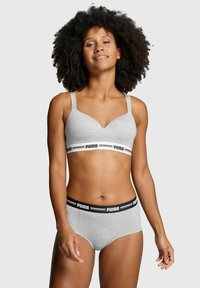 Gray bra and underwear set featuring adjustable straps and a branded elastic waistband. Smooth texture with a minimalist design.