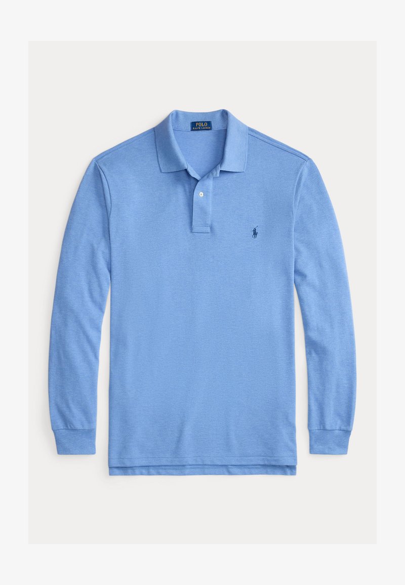 Heledane pikkade varrukatega polo särk, mis on valmistatud puuvillast. Omab kahte nupuga avamist, soonikuga varrukaotsasid ning väikest logo vasakul rinnal.