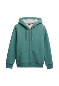 Sudadera con cremallera en color verde azulado, con un suave forro de felpa blanca. Presenta cordones con puntas doradas, bolsillos frontales y un pequeño logo en el pecho.