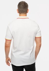 Paradiso Clothing GUNS N' ROSES PISTOLS UNISEX - Polo shirt - white