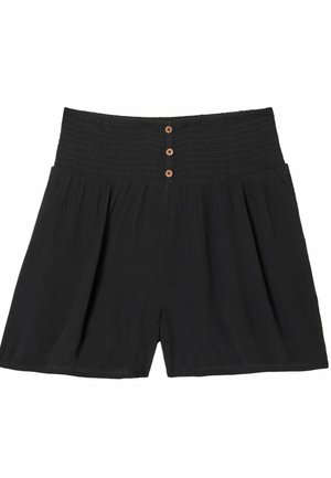 Čierne krátke nohavice s vysokým pásom, širokým elastickým pásom a tromi malými hnedými gombíkmi v strede vpredu.