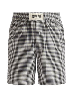 Men’s navy and beige checkered boxer shorts with elastic waistband and central button fly, label reading "House of Sunny" on waistband.