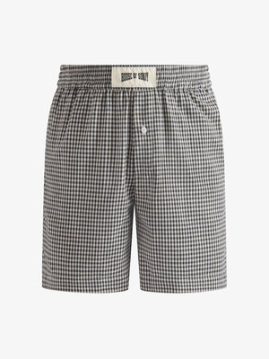 Men’s navy and beige checkered boxer shorts with elastic waistband and central button fly, label reading "House of Sunny" on waistband.