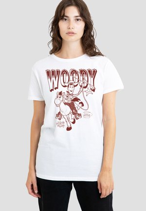 Young woman wearing white T-shirt with brown Woody cowboy character riding horse and holding lasso from Toy Story.