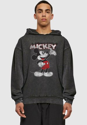 Felpa nera con cappuccio caratterizzata da una grafica di Topolino. Il design include accenti rossi e bianchi, con una vestibilità rilassata e polsini a costine.