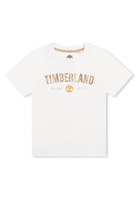 Witte katoenen T-shirt met "TIMBERLAND" in goud gedrukt, met daaronder "NH. USA EST73" en een geel logo. Korte mouwen, ronde hals.