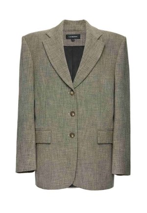 Hallikas tekstuuriga bleiser sälguga kraega, kahe esitasku, kolme pruuni nupu ja musta sisevoodriga. Sildil on kiri "LA MANIA."