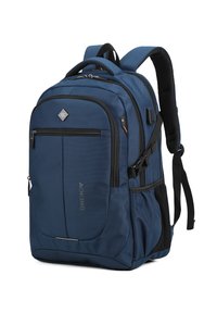 Un sac à dos bleu foncé avec plusieurs compartiments zippés, des bretelles rembourrées, des poches en maille latérales et une poignée de portage sur le dessus.