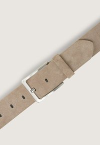 Beige suede watch strap with a silver metal buckle, featuring several holes for adjustment, and a smooth, textured finish.
