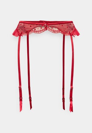 Liguero de encaje rojo con borde festoneado, tirantes de satén y clips ajustables. Presenta un charm decorativo en forma de corazón en el centro.