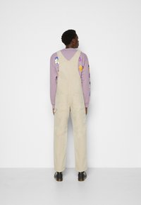 Carhartt WIP BIB OVERALL - Macacão de ganga - dusty brown faded